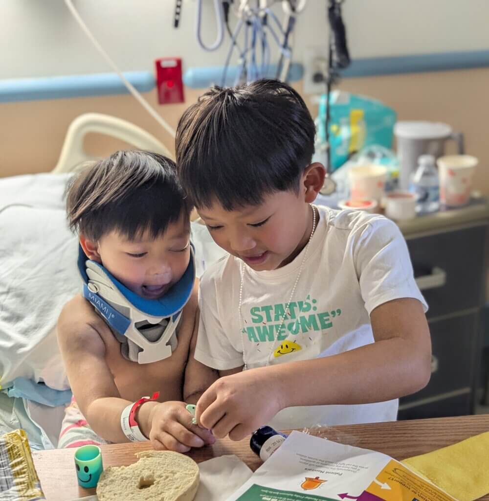 The injured child is having a visit from his sibling