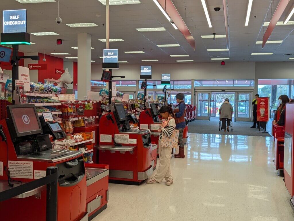 Paying at self checkout on her own, for the first time